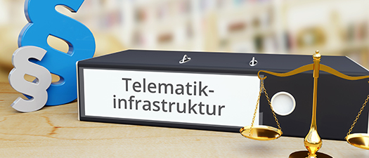Symbolbild: Paragraphen, Gerichtswaage und ein Ordner auf dem Telematikinfrastruktur steht