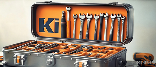 Bildbeschreibung: Auf dem Foto ist ein Werkzeugkasten aus Metall zu sehen. Er ist aufgeklappt und im Deckel befinden sich Schraubenzieher in unterschiedlicher Größe. Der Innenteil des Deckels ist orangefarben und in Großbuchstaben ist KI in Schwarz gedruckt.
